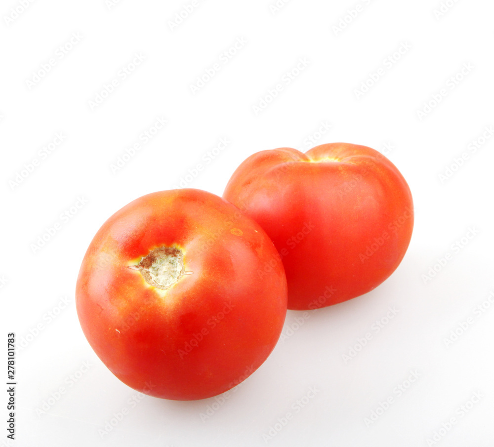 Close-Up Of Red Tomatoes On White Background. Close-Up Of Red Tomatoes On White Background.