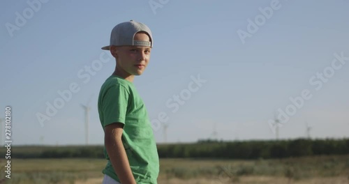 Boy standing in field photo