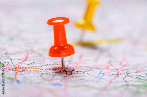 Red and yellow Pushpins on a map