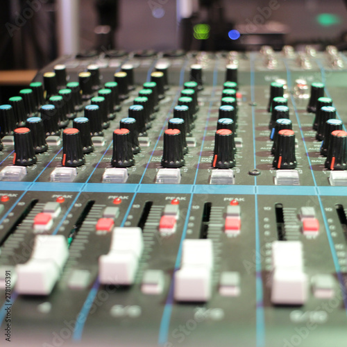 recording studio professional audio mixer close-up, blurred