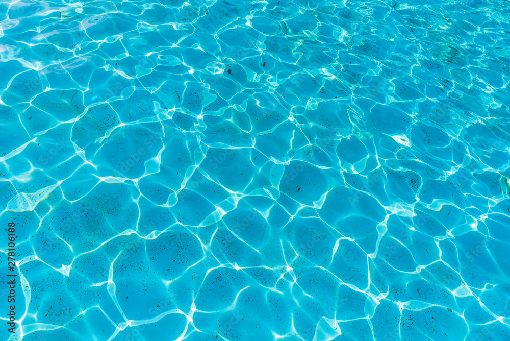 Surface of blue swimming pool, background texture of water