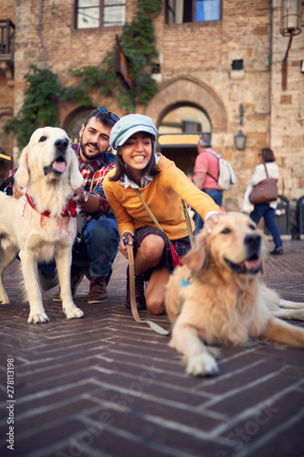 Happy people with dog laughing and having fun on journey..