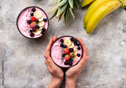 Acai bowl in coconut plate.