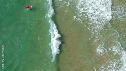 Beautiful view of the sea from above surfers and waves