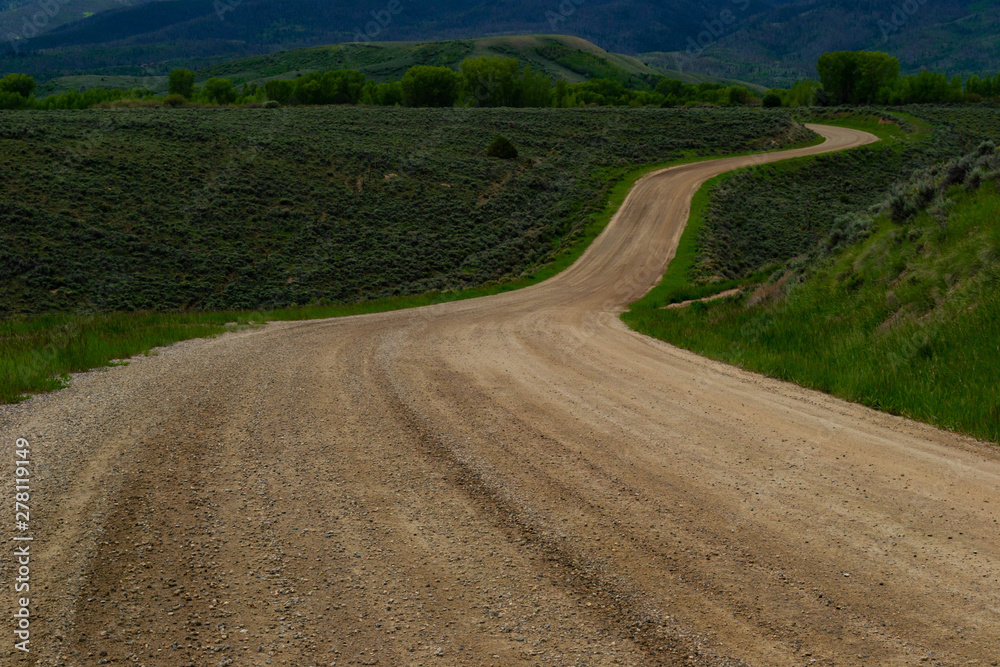 a winding, dusty dirt road to nowhere