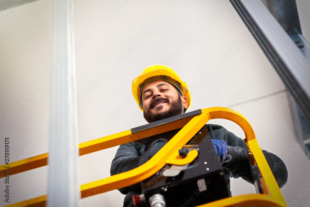 Fototapeta premium Worker builds a plasterboard wall.