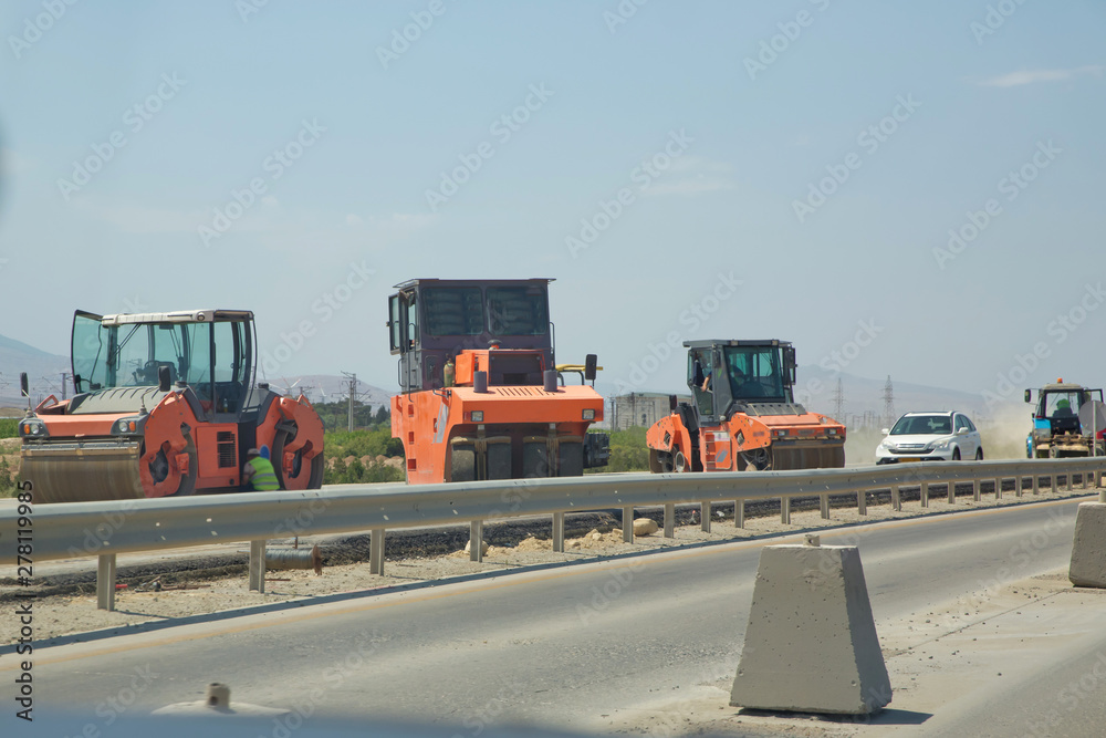 construction site equipment Heavy vibration roller compactor or road roller for building new road, compacting asphalt . Road construction, asphalt pavement works, renewal process construction site equipment Heavy vibration roller compactor or road roller for building new road, compacting asphalt . Road construction, asphalt pavement works, renewal process