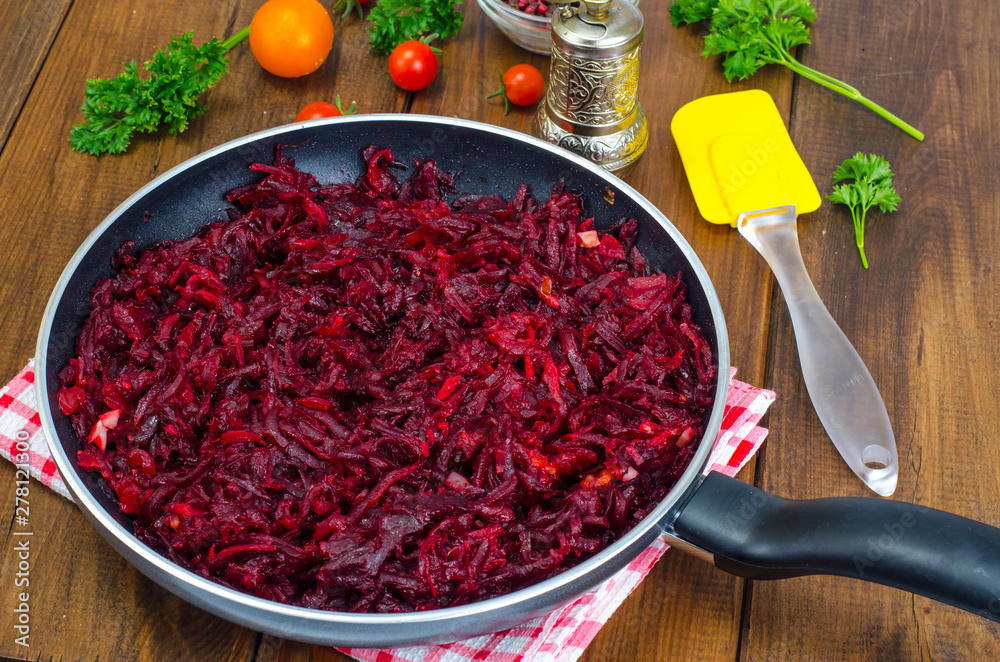 Dietary dishes. Stewed beet in frying pan Dietary dishes. Stewed beet in frying pan