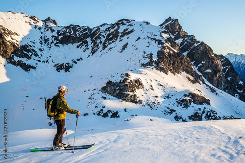 Skier in the backcountry of Alaska enjoying the first light of spring sunrise. © DCrane Photography