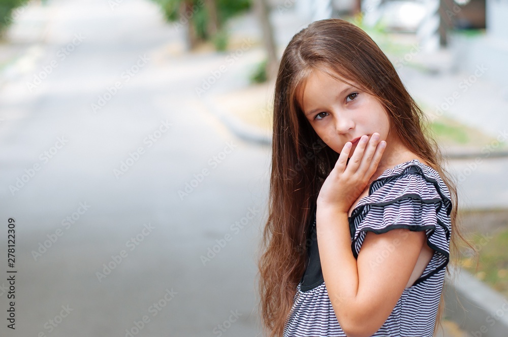 Little cute girl street city lifestyle shooting, summer, smiling at camera Little cute girl street city lifestyle shooting, summer, smiling at camera