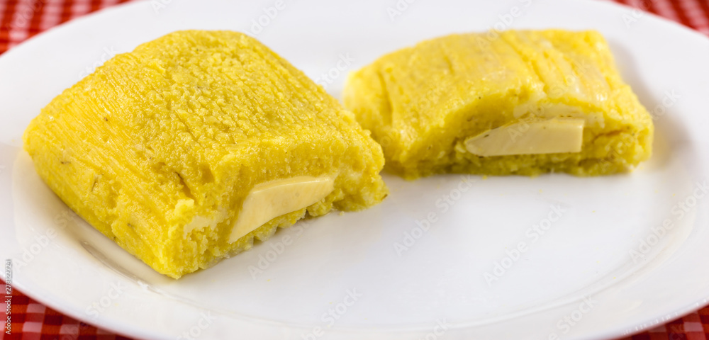 Pamonha, Brazilian sweet corn with cheese filling. Pamonha typical of Brazil, food of the state of minas gerais and goiais. Concept of traditional food. Brazilian food Pamonha, Brazilian sweet corn with cheese filling. Pamonha typical of Brazil, food of the state of minas gerais and goiais. Concept of traditional food. Brazilian food