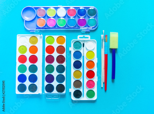 Stationery flat lay.Paints and brushes for creativity. Back to school.
