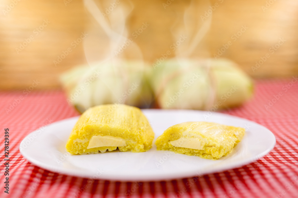 Pamonha, Brazilian sweet corn with cheese filling. Pamonha typical of Brazil, food of the state of minas gerais. Concept of traditional food. Brazilian food at rural parties in June and July.