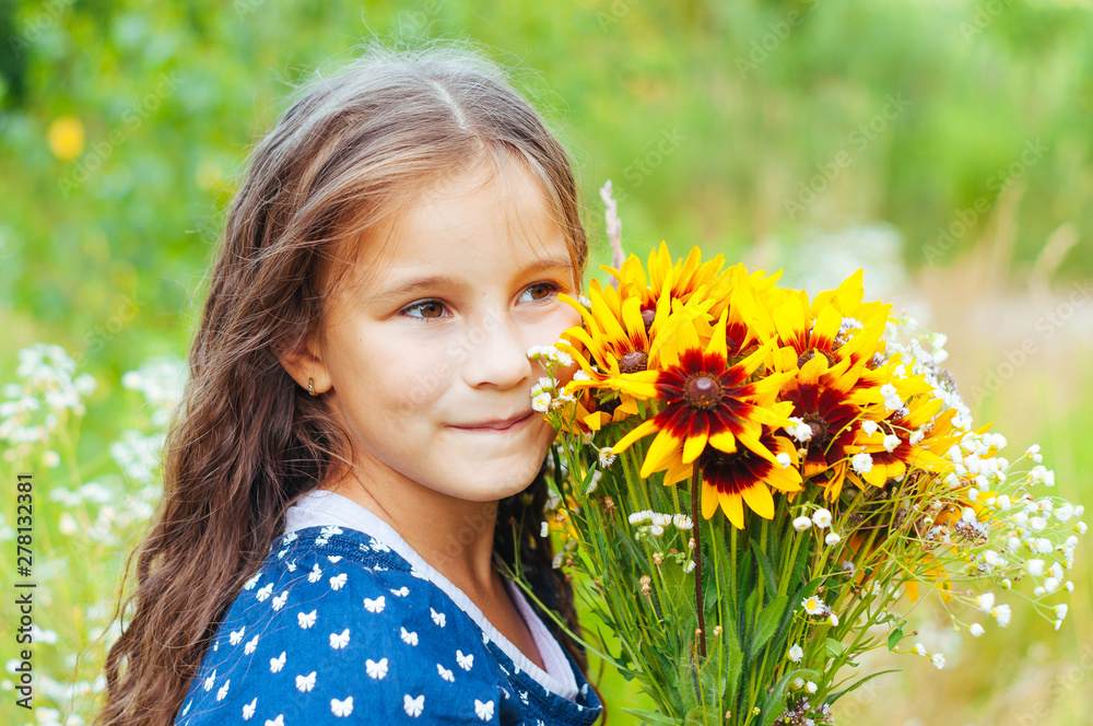 Little adorable girl gathered a bouquet of wild flowers Little adorable girl gathered a bouquet of wild flowers