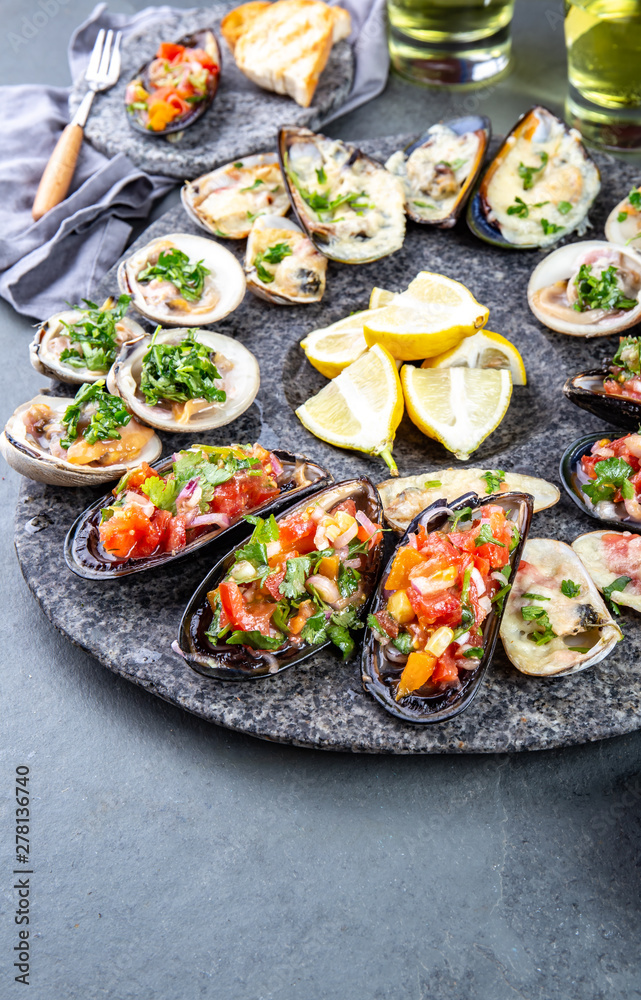 Seafood assorted platter Macha and mussels a la parmesana, mussels a la chalaca, clams with herb sauce Seafood assorted platter Macha and mussels a la parmesana, mussels a la chalaca, clams with herb sauce