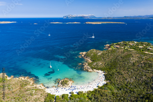 View from above, stunning aerial view of a beautiful beach bathed by a turquoise clear sea. Spiaggia del Principe, Costa Smeralda (Emerald Coast) Sardinia, Italy.