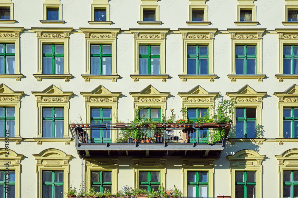 Facade of a green renovated old apartment buildings seen in Berlin, Germany
