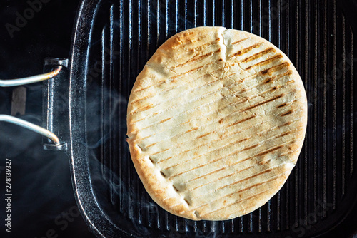 grilled pita bread on the pan photo