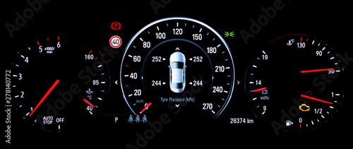 TPMS (Tyre Pressure Monitoring System) monitoring display on car dashboard panel. The pressure measurement given in kilopascal (kPa). Malfunction or check engine warning light control on car dashboard