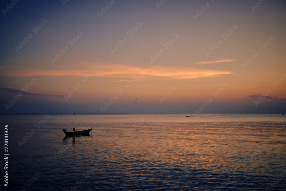 sunrise skyline seascape with small silhouette fisherman boat