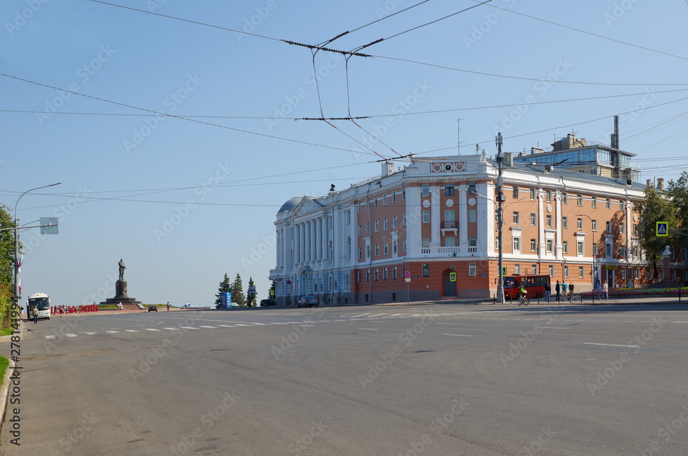 Nizhny Novgorod, Russia - August 19, 2018: Minin and Pozharsky square, house №8, №10 and monument to Valery Chkalov Nizhny Novgorod, Russia - August 19, 2018: Minin and Pozharsky square, house №8, №10 and monument to Valery Chkalov