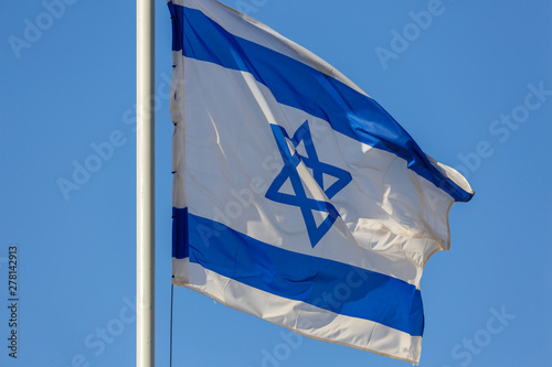 Close up view on white and blue flag of Israel