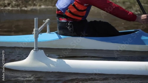 Close up of Disabled athlete using paddle in a canoe. Rowing, canoeing, paddling. Training. Kayaking. paraolympic sport. canoe for disabled people. photo