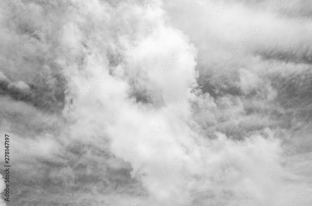 Gray sky with white clouds with blurred pattern background