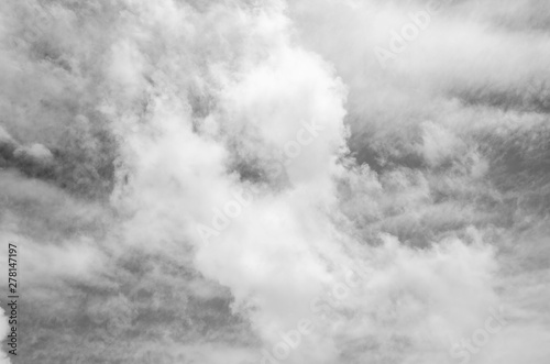 Gray sky with white clouds with blurred pattern background