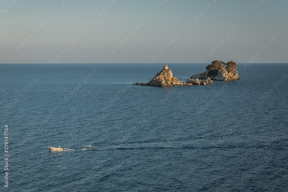 Boat on the Adriatic Sea and Islands Sveta Nedjelja and Katic in Montenegro