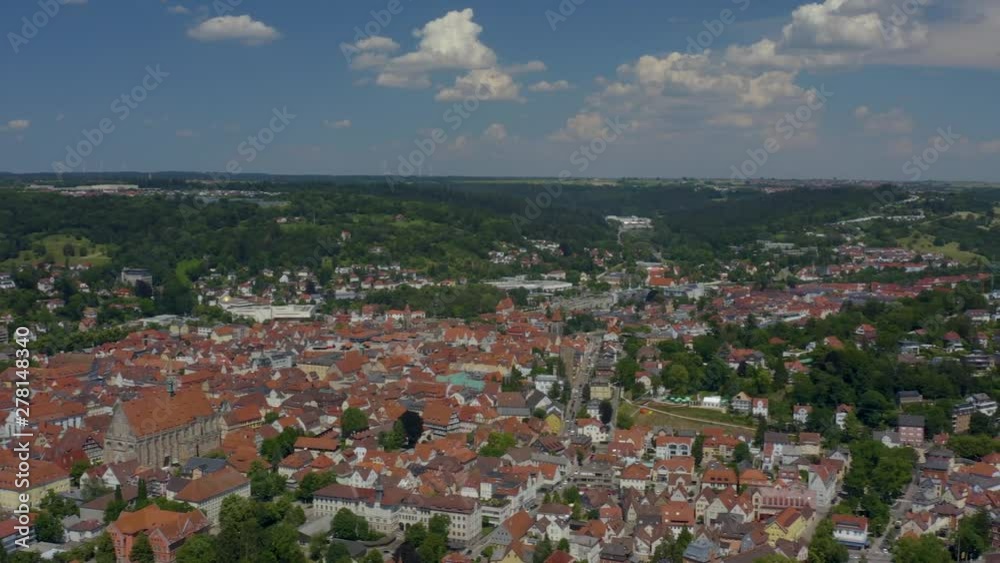 Aerial of the old part of town of Schwäbisch Gmünd in Germany. Camera rotates right, panorama of city with forest and hills in the background. Aerial of the old part of town of Schwäbisch Gmünd in Germany. Camera rotates right, panorama of city with forest and hills in the background.