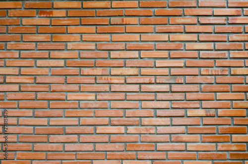 Old red brick wall with blurred pattern background