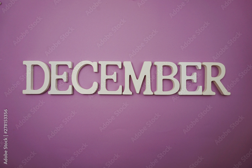 December alphabet letter with space copy on purple background