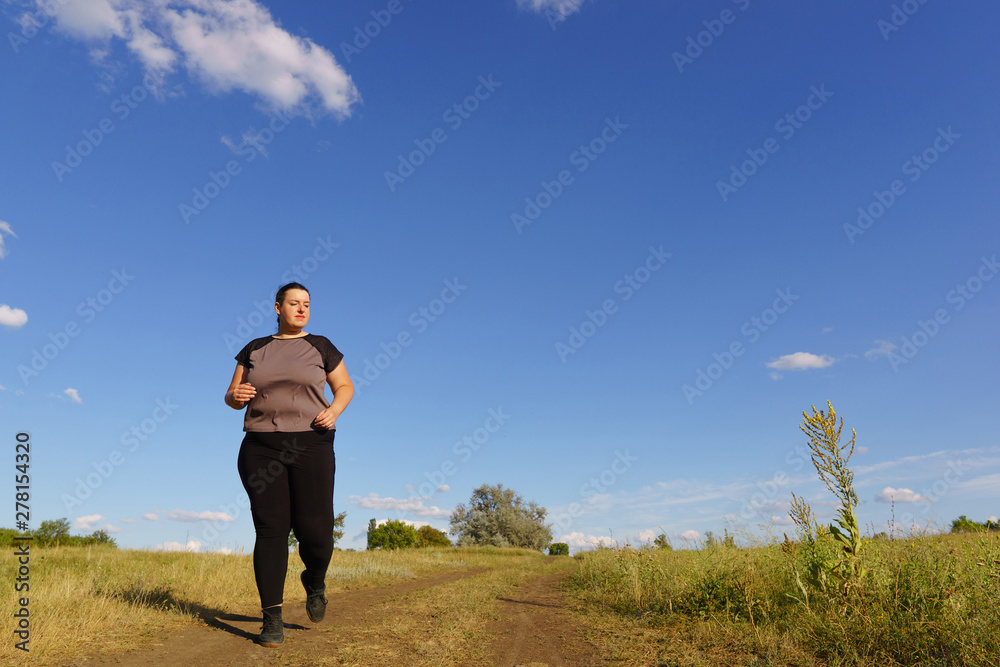 Weight loss, outdoor activity, exercising, healthy lifestyle, jogging. Overweight woman running in countryside Weight loss, outdoor activity, exercising, healthy lifestyle, jogging. Overweight woman running in countryside
