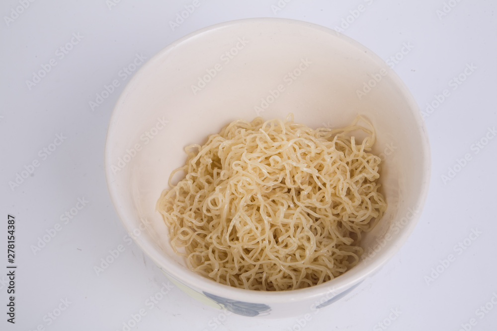 Bowl of boiled egg noodles isolated on white background.