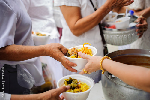 Food sharing in human societies can help homeless people : concept Sharing Food With Homeless