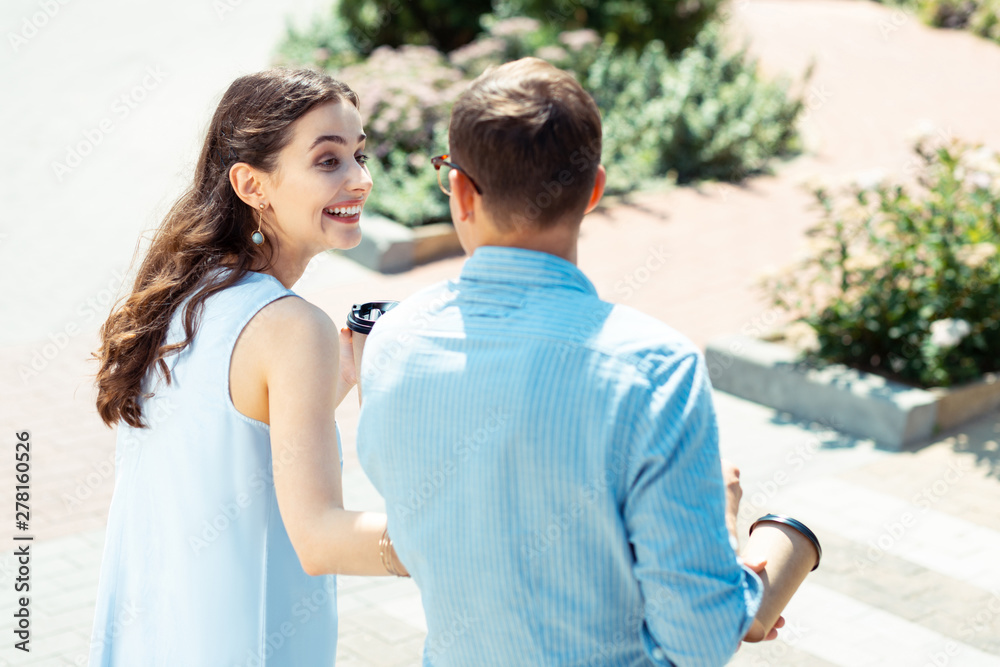 Curly girlfriend laughing while talking to her man Curly girlfriend laughing while talking to her man