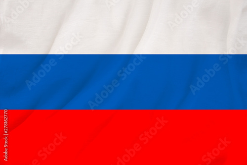 national flag of the country Russia on gentle silk with wind folds, travel concept, immigration, politics