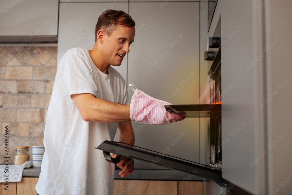 Loving handsome husband baking croissants in the morning