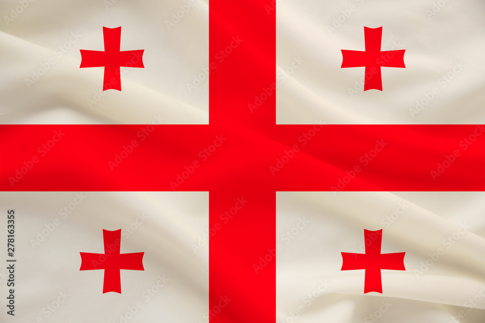 national flag of the country of Georgia on the gentle silk with folds from the wind, the concept of travel, immigration, politics national flag of the country of Georgia on the gentle silk with folds from the wind, the concept of travel, immigration, politics