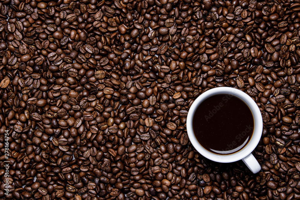 cup of coffee on coffee beans background cup of coffee on coffee beans background