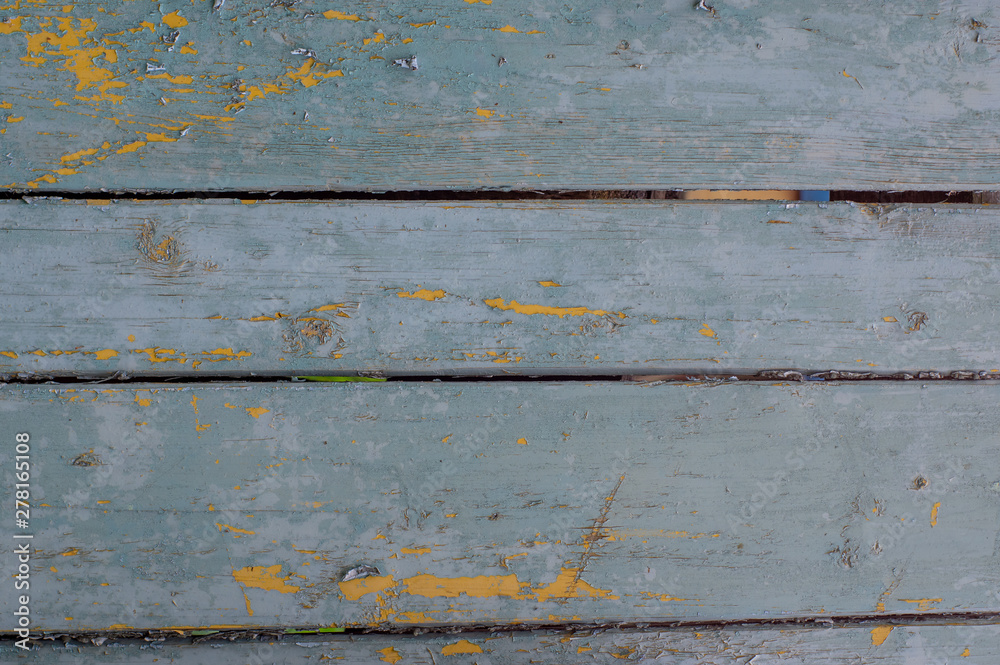Multicolored bright old planks with cracked paint Multicolored bright old planks with cracked paint