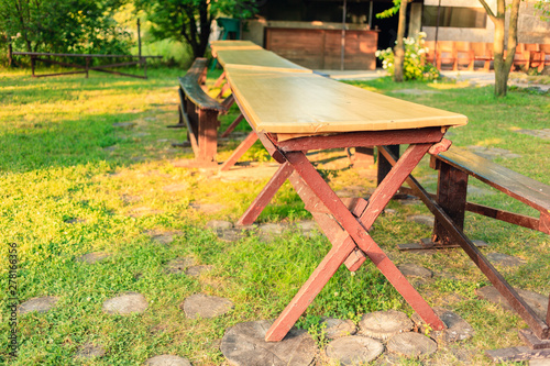 Dinner table in the garden of the camp. Outdoor table for children.