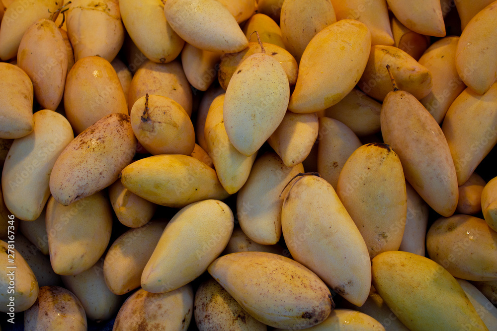 Close-up mango fruit at market background Close-up mango fruit at market background