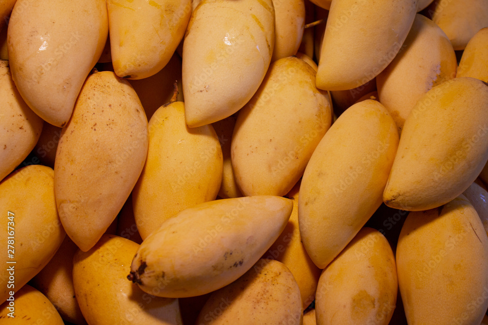 Close-up mango fruit at market background Close-up mango fruit at market background