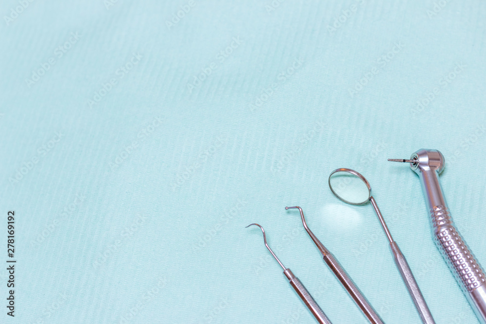 Fototapeta premium Dentist tools - probe, mirror, tweezers and drill