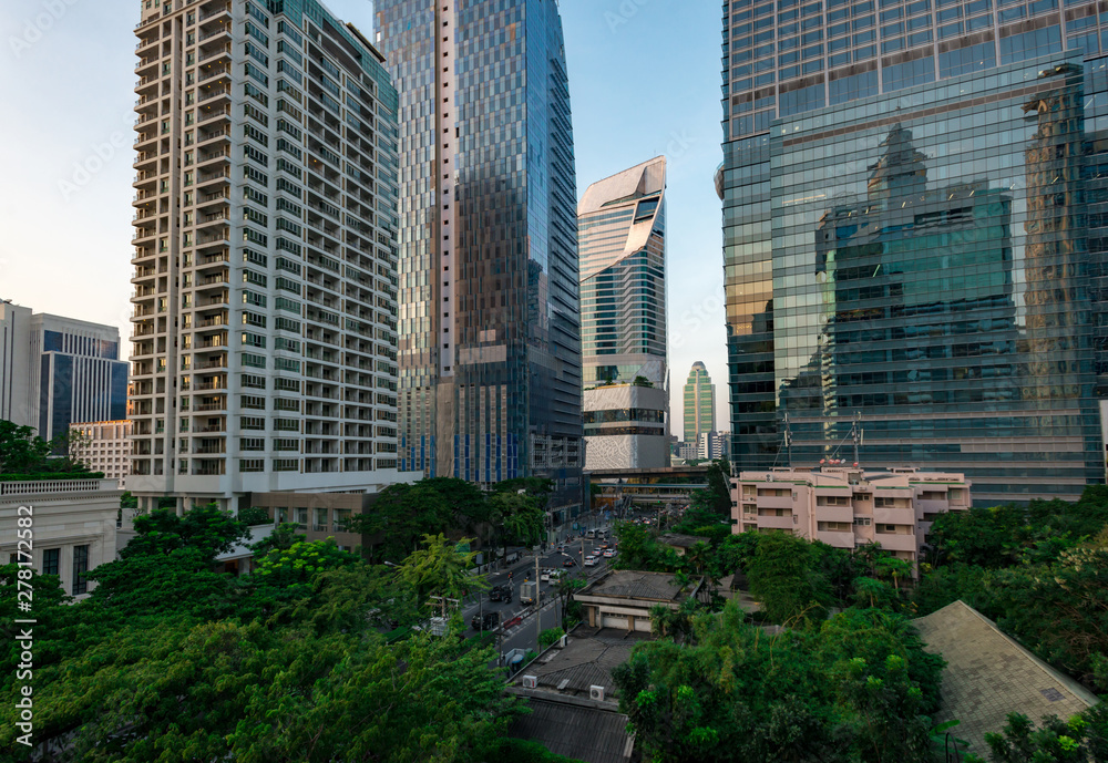 Tranquility inside the city. Image of green zone and modern buildings (Bangkok, Thailand) Tranquility inside the city. Image of green zone and modern buildings (Bangkok, Thailand)