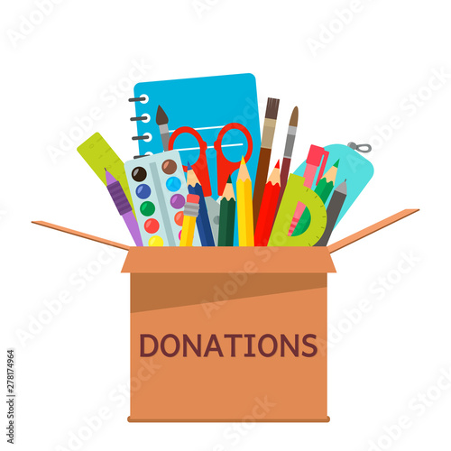 brown cardboard box for donations full of stationery to a school for poor people.