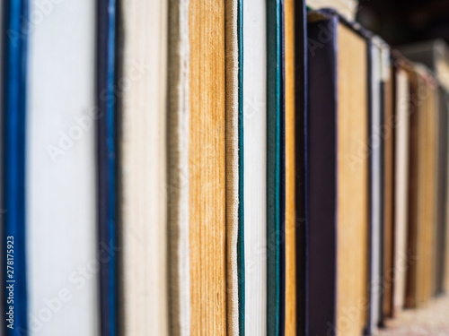 Old books in a row. Yellowed and crumpled pages of books