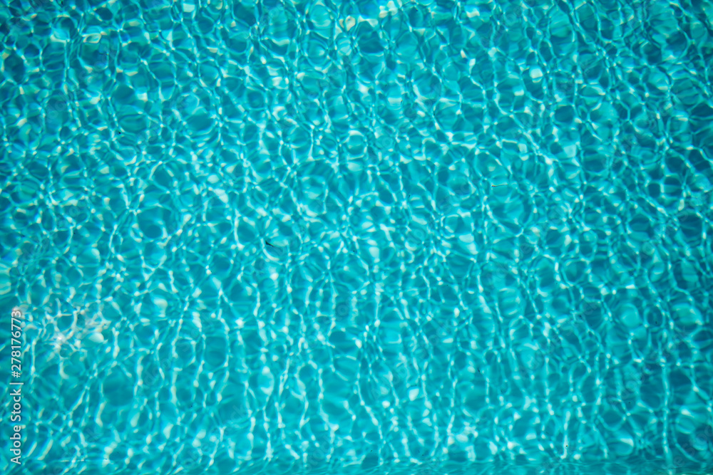 Swimming pool with sunny reflections